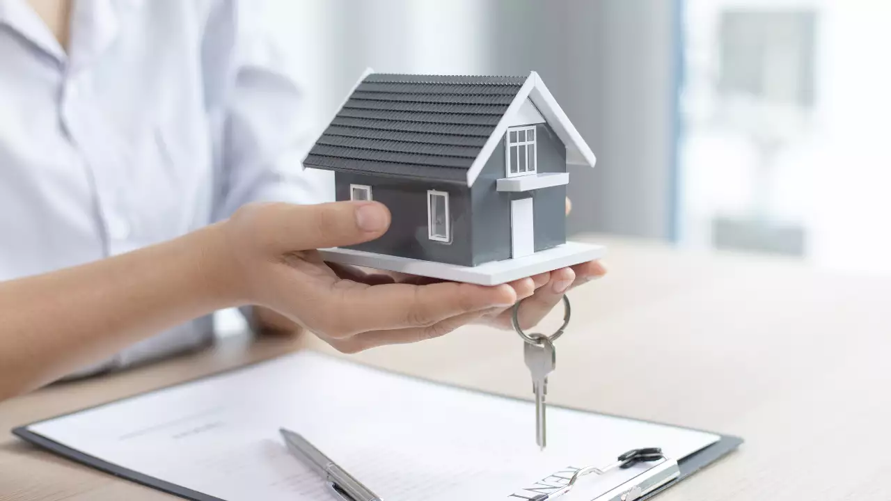 Image of a person giving his home as a security for personal loan